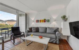 a living room with a couch and a table at Lejl, 207 St, in Fanø