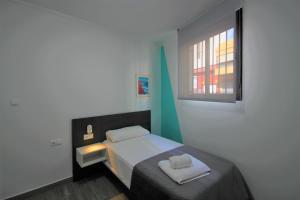 Posteľ alebo postele v izbe v ubytovaní CASATURIS NEWON APARTAMENTOS en EL CAMPELLO