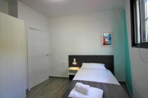 Posteľ alebo postele v izbe v ubytovaní CASATURIS NEWON APARTAMENTOS en EL CAMPELLO