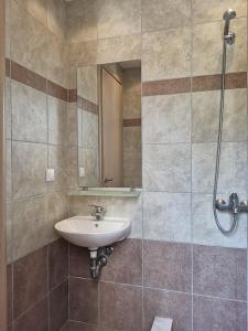 a bathroom with a sink and a shower at 3 Bed Villa In Lardos Village in Lardos
