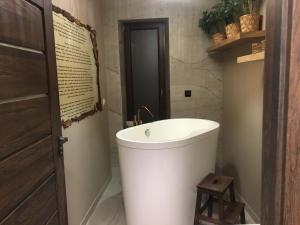 a bathroom with a white tub and a toilet at LIKE HOME 3 CENTRUM RYNEK in Świdnica