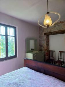 Tempat tidur dalam kamar di Cà Burghin