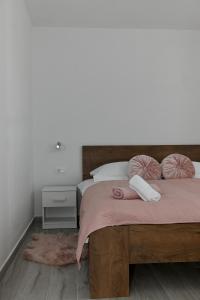 Postel nebo postele na pokoji v ubytování Golden Neretva apartments