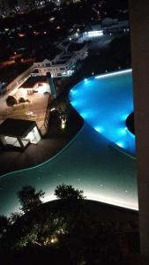 a view of a swimming pool at night at Mikael Homestay Kuala Lumpur in Kuala Lumpur