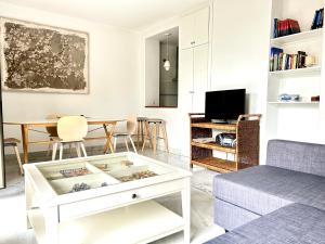 TV a/nebo společenská místnost v ubytování Hipalis Palmera