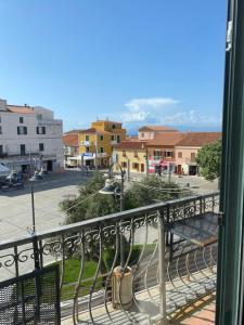 a balcony with a view of a street and buildings at Monolocale Nonna Ita in Santa Teresa Gallura