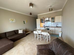 a living room with a couch and a table and a kitchen at sea View Nautilus free wi-fi Sal Rei in Sal Rei