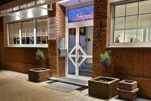 a front door of a store with a sign on it at Hotel Imperial in Krefeld