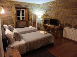 Postel nebo postele na pokoji v ubytování Casa de Ferrapilhe