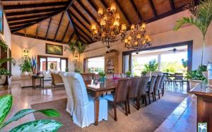 a dining room with a table and chairs at Holiday Villa 27 in La Romana