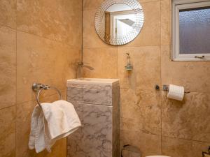 a bathroom with a shower and a mirror at Pass the Keys Beautiful Wembley Entire House in London