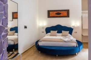 Cama o camas de una habitación en Lovely Rooms - Guest House Suites