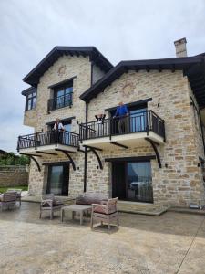 two people on the balcony of a building at MERYEM HANIM BUTİK OTEL in Fatsa