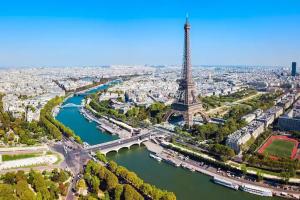 an aerial view of the eiffel tower and a river at Charmant logement proche Disneyland Paris parking in Lagny