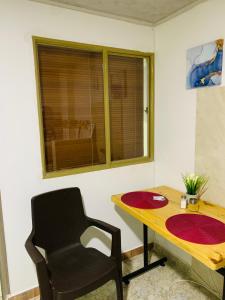 a room with a desk and a chair and a window at Bogotá Kings 302 in Bogotá +33 photos