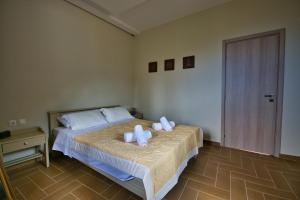 Postel nebo postele na pokoji v ubytování West Crete House