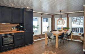 a kitchen with a table and chairs in a room at Pet Friendly Home In Gol With Sauna in Gol