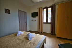 Postel nebo postele na pokoji v ubytování West Crete House + 37 fotografií