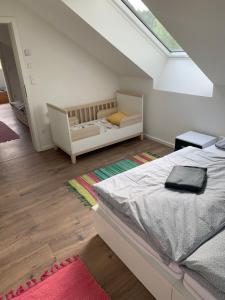 Postel nebo postele na pokoji v ubytování Wohnung am Fuße des Schwarzwalds