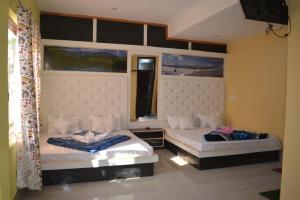 Letto o letti in una camera di Nice One Palace