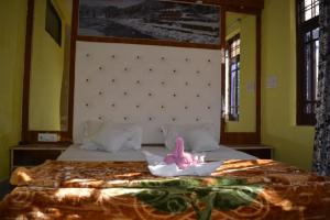 Letto o letti in una camera di Nice One Palace
