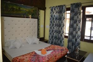 Letto o letti in una camera di Nice One Palace
