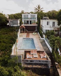 an aerial view of a house with a swimming pool at Ground Floor Apartment -Villa Ibiza in Trou dʼ Eau Douce