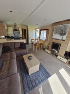 a living room with a couch and a table at Kielder in Morpeth