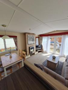 a living room with a couch and a table at Kielder in Morpeth
