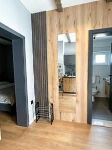 a room with a door leading to a bedroom at Old Town Premium Apartments in Mostar