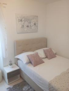 Postel nebo postele na pokoji v ubytování Apartments Šime