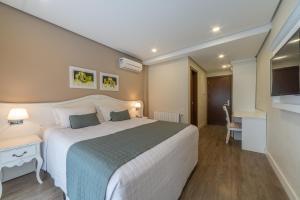 Postel nebo postele na pokoji v ubytování Hotel Monte Felice Bosque