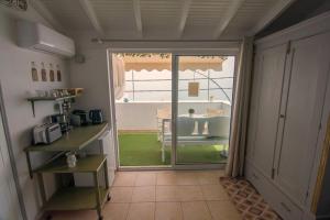 a room with a door open to a room with a table at Ireon Holiday Home in Ireon