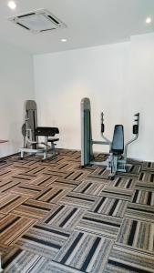 a salon with three chairs and a carpet at Flowers @ Country Garden Danga Bay in Johor Bahru +36 photos