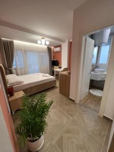 Postel nebo postele na pokoji v ubytování Hotel Luris