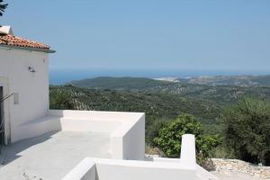 a white house with a view of the mountains at Casa San Valentino in Vico del Gargano