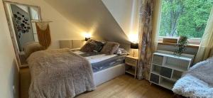 Posteľ alebo postele v izbe v ubytovaní Comfort Zone Ostroda BOHO SCANDI