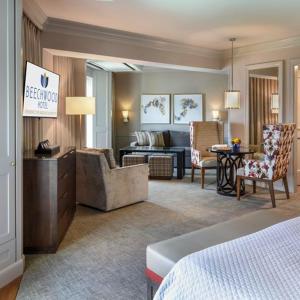 a hotel room with a living room and a bedroom at Beechwood Hotel in Worcester