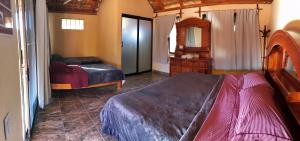 Postel nebo postele na pokoji v ubytování Bungalows Cabo Pulmo