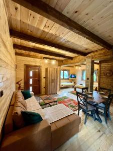 a living room with a couch and a table at Mountain Star House in Mojkovac