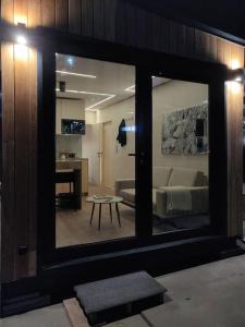 a view of a living room with a large mirror at tiny house in Rotterdam