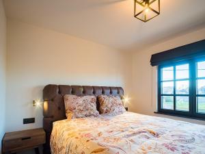 Postel nebo postele na pokoji v ubytování Welldone Resort - Cozy Saxofoon