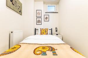 a bedroom with a bed with an elephant blanket at New Apartment near Nisantasi & Macka Park in Istanbul