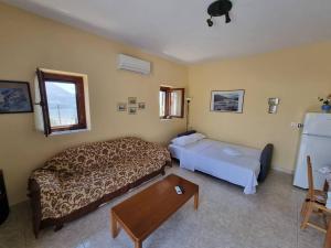 Ένα ή περισσότερα κρεβάτια σε δωμάτιο στο Castle in Oitylo