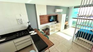 Η κουζίνα ή μικρή κουζίνα στο LOFT PRAIA GRANDE Vista Mar