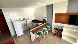 Η κουζίνα ή μικρή κουζίνα στο LOFT PRAIA GRANDE Vista Mar +21 φωτογραφίες