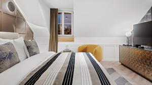Voodi või voodid majutusasutuse Boutique Hotel Wellenberg toas