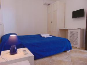 A bed or beds in a room at Agriturismo Villa Tommaso