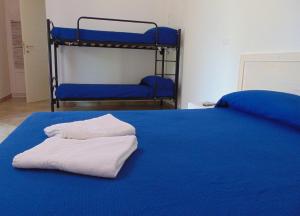 A bed or beds in a room at Agriturismo Villa Tommaso
