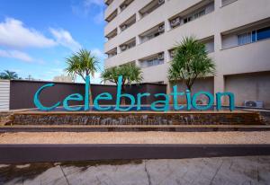 a sign for a hotel in front of a building at Celebration Resort Olímpia by Hot Beach in Olímpia